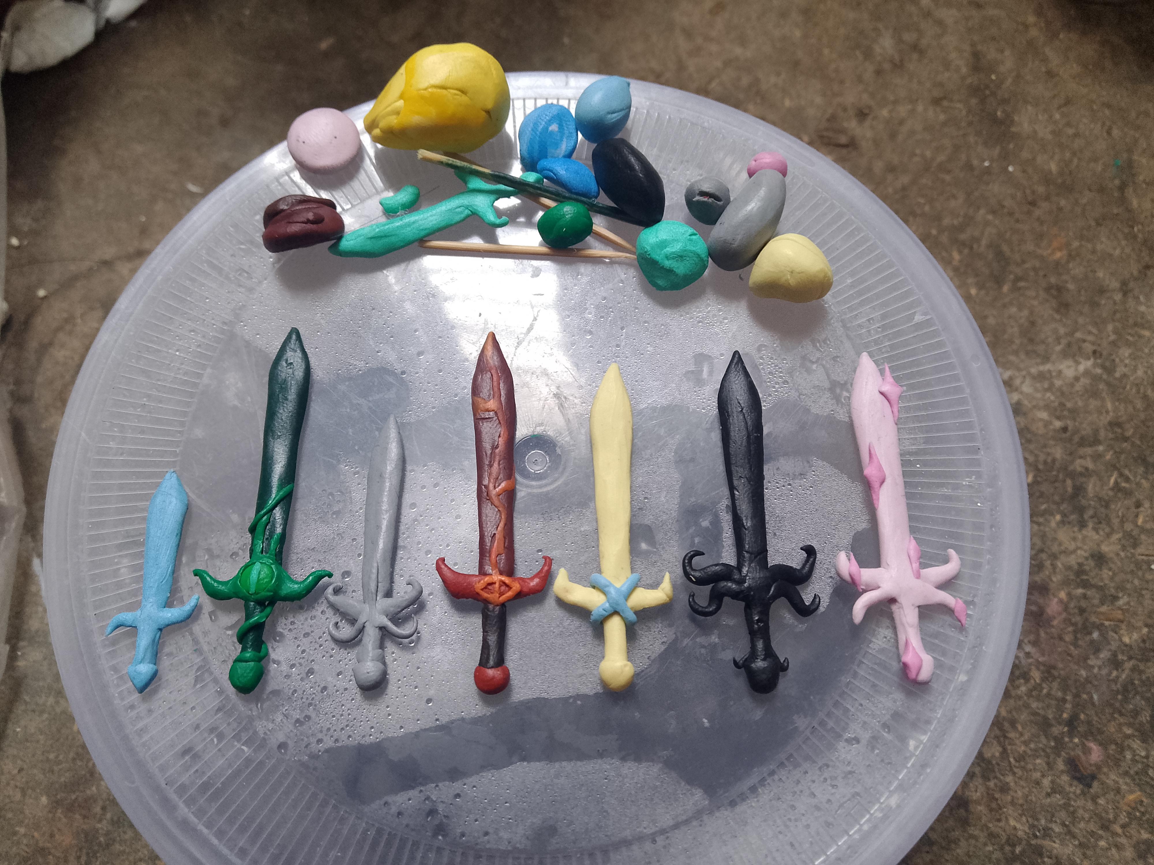 Miniature SFOTH swords sculpted and painted in clay