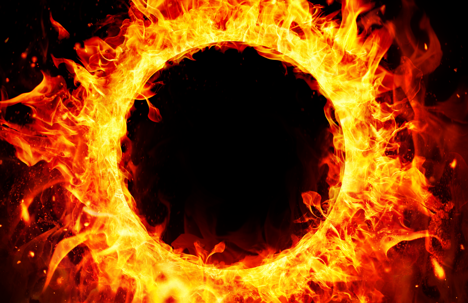 A bright ring of flames frames a dark center.